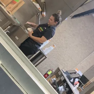 Manager handling food during covid-19 without gloves and mask while touching her dirty phone