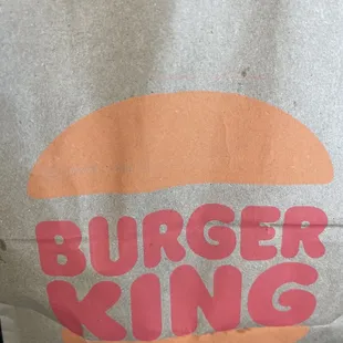 a paper bag with a burger on it