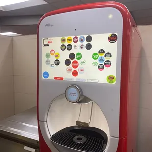 a soda dispenser in a kitchen