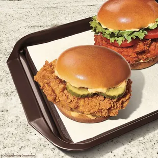 two burgers on a tray