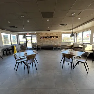 empty tables and chairs in a restaurant