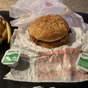 a hamburger and french fries on a tray