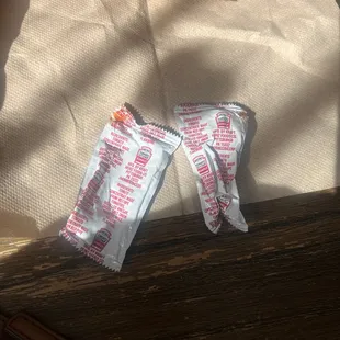 The open and used ketchup packets given to us.