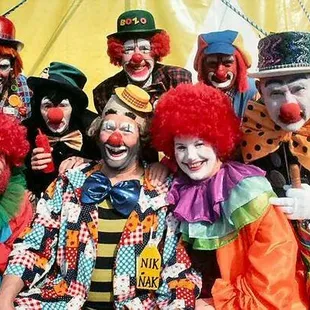 a group of clowns posing for a picture