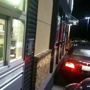 cars parked in front of a fast food restaurant