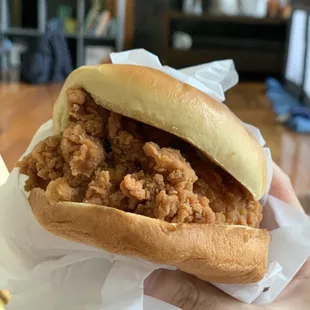 Their hand breaded chicken sandwich was just ok. The breading was way too much. Popeyes is still the champ