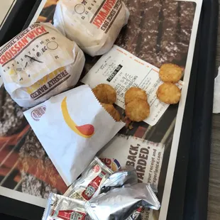 a tray of food and a newspaper