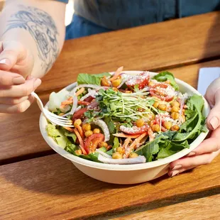a woman eating a salad