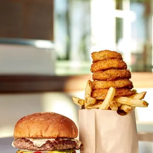 a burger and fries on a table