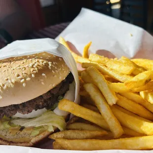 a hamburger and fries in a basket