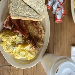 2 French Toast 3 Eggs with Bacon and hush-brows.
