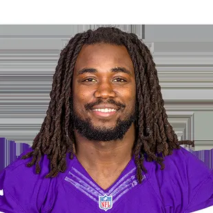 a football player with dreadlocks