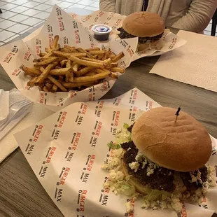 two burgers and a side of fries