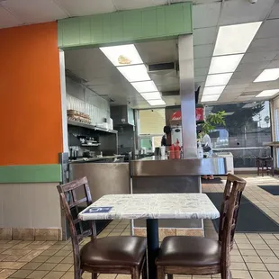 a table and chairs in a restaurant