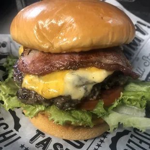 The Handler double: two grass fed patties, smoked bacon, Gouda and American cheese with lettuce, tomato, onions, and Bourbon Ops glaze
