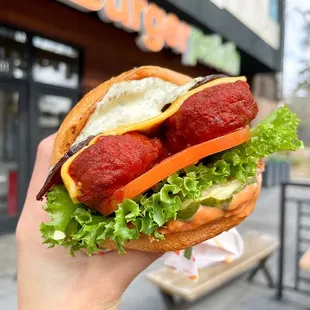 Spicy vegan chicken, bacon sandwich with cheddar, lettuce, tomato, ranch &amp; bbq sauce. Build it on the BP app for pickup or delivery.