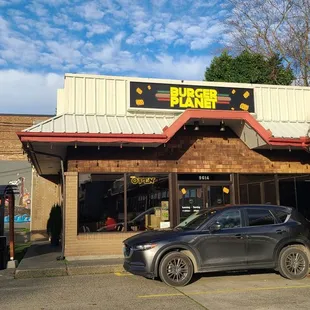 a car parked in front of the restaurant