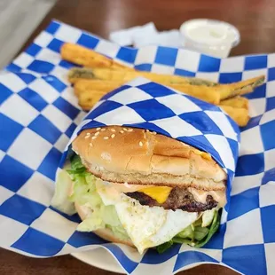 a burger and french fries on a table