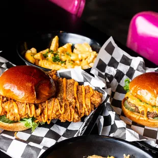 hree burgers and fries