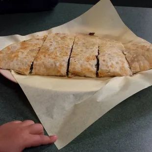 Carne asada quesadilla. Like 12 inches long or longer. And fat. Ask for the green salsa. Yumm!