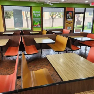 empty tables and chairs in a restaurant