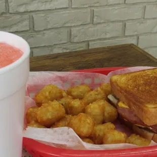 The Grilled Ham and Cheese Combo.  Pictured with Tator Tots and Pink Lemonade. Two thick Slices of Ham Grilled up Just right on Texas Toast