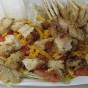 LG. Grilled Chicken Salad shown here. Tasty Chicken Breast Grilled and diced up over a bed of fresh Iceberg lettuce with tomatoes and cheese