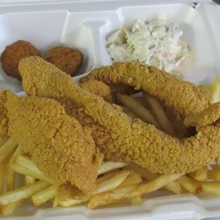 Fish Dinner.  3 fillets with your choice of side.  Comes with Slaw, Hushpuppies and a Large Drink.   This is one of our best sellers.