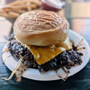 Oklahoma Burger with grilled onions, double.