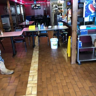 empty tables and chairs in a restaurant