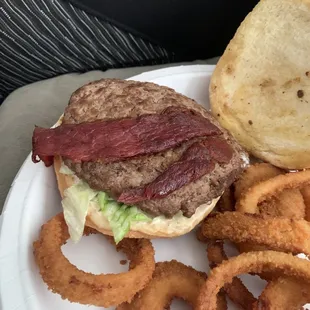 Super thin and overcooked patty with a tiny piece of bacon that eats more like jerky.