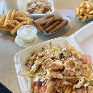 Grilled chicken salad, fried zucchini, chili cheese fries.
