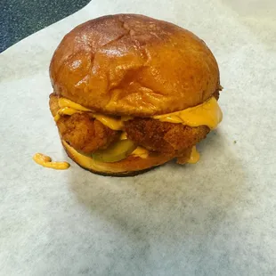 Spicy chicken sandwich with chipotle sauce and pickles.pepper jack cheese is in add on.