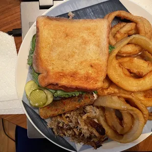 Burger on Texas toast, onion rings, SOB cheese stick, and a side of pulled pork.