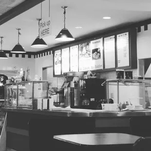 a black and white photo of a restaurant