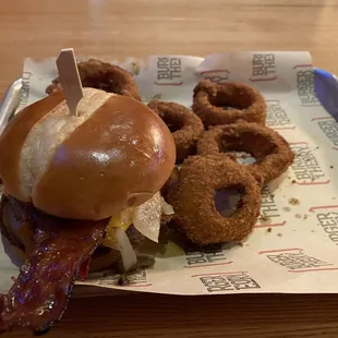 Bacon cheese burger with onion rings.