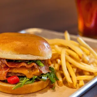 a burger and fries on a tray