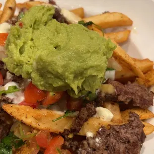 Here's where the list me. Nacho fries with beef.  Why is the beef a broken up hamburger patty? They could've kept the frozen patty