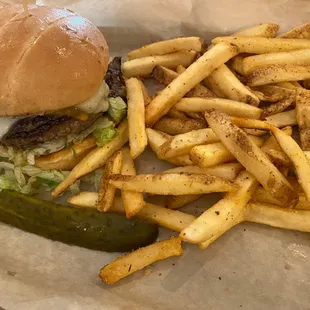 a plate of fries and a pickle