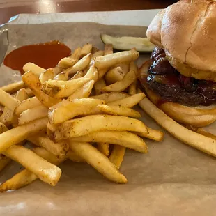 a burger and fries on a tray