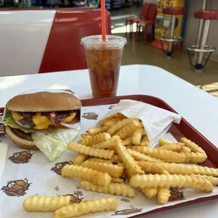 Bacon cheeseburger and fries combo.