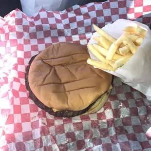 a hamburger and french fries in a basket