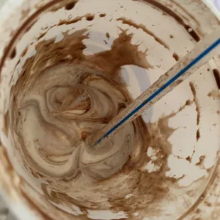 a bowl of melted chocolate with a spoon in it