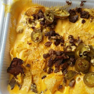 Very soggy salty lil meat stall chips watery cheese!