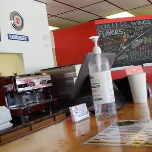 menus on the counter and menus on the wall