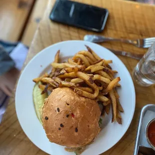 a plate of french fries and a glass of wine