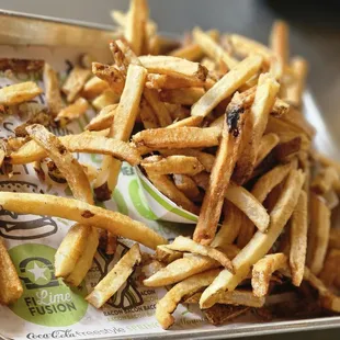 a tray of french fries on a table