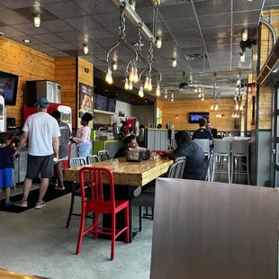 a view of a restaurant with people eating