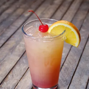 a drink with a cherry on top