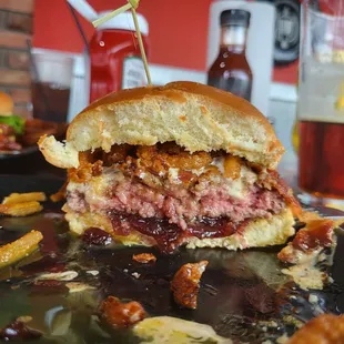 a burger with a bite taken out of it